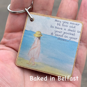 Girl on a beach keychain key ring